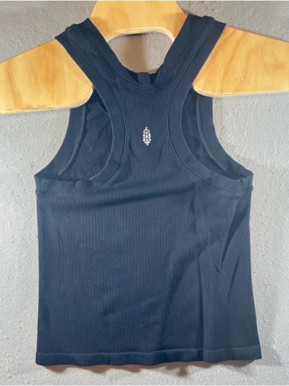 Ribbed Black Racerback Tank with Decorative Emblem